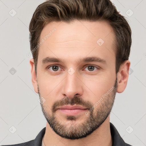 Neutral white young-adult male with short  brown hair and brown eyes