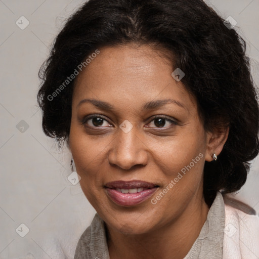 Joyful black adult female with medium  brown hair and brown eyes