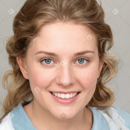 Joyful white young-adult female with medium  brown hair and blue eyes