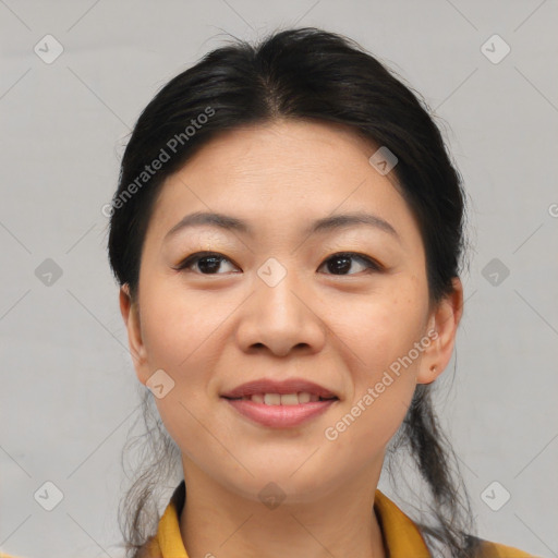 Joyful asian young-adult female with medium  black hair and brown eyes