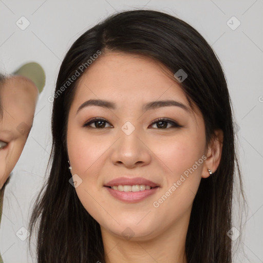 Joyful latino young-adult female with long  brown hair and brown eyes