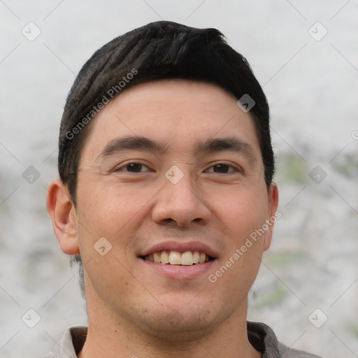 Joyful white young-adult male with short  black hair and brown eyes