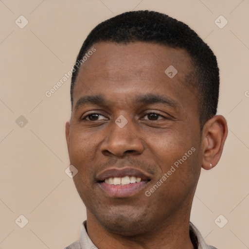 Joyful black young-adult male with short  black hair and brown eyes