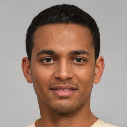 Joyful latino young-adult male with short  brown hair and brown eyes