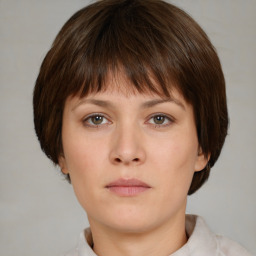 Neutral white young-adult female with short  brown hair and brown eyes