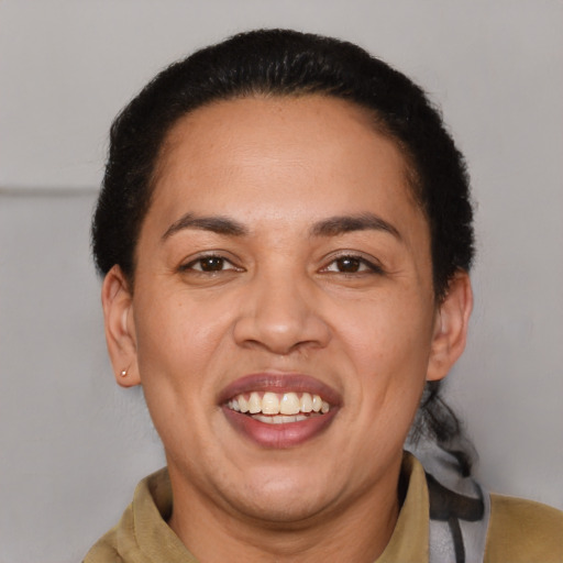 Joyful latino adult female with short  brown hair and brown eyes
