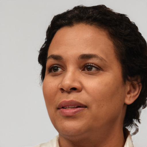 Joyful white adult female with short  brown hair and brown eyes