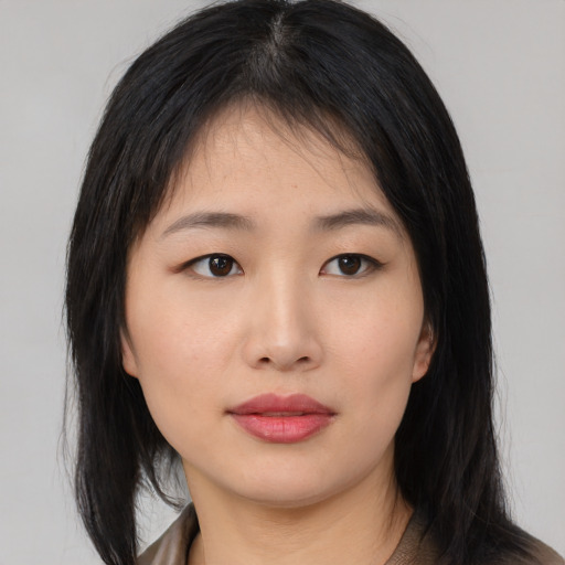 Neutral asian young-adult female with medium  black hair and brown eyes
