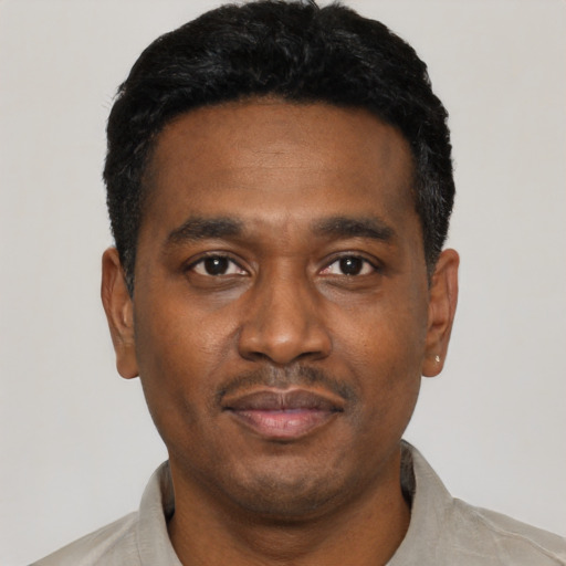 Neutral black young-adult male with short  black hair and brown eyes