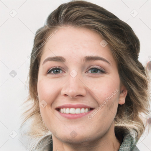 Joyful white young-adult female with medium  brown hair and blue eyes