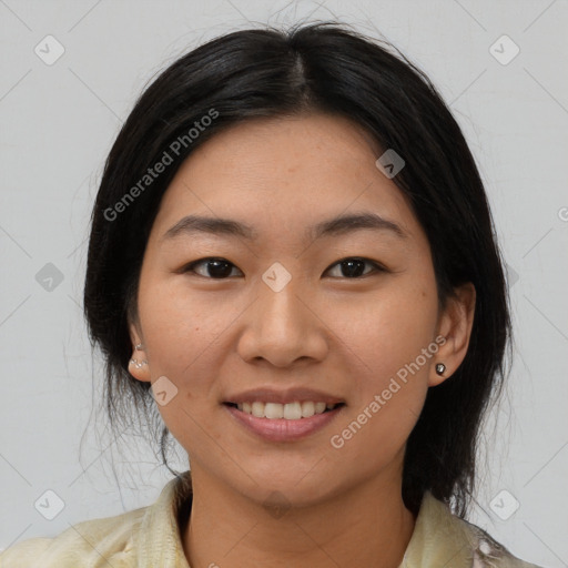 Joyful asian young-adult female with medium  black hair and brown eyes