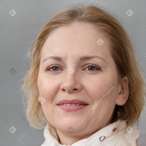 Joyful white adult female with medium  brown hair and blue eyes