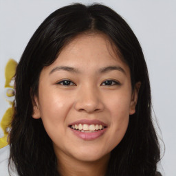 Joyful asian young-adult female with long  brown hair and brown eyes