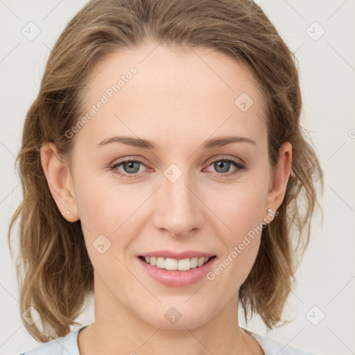 Joyful white young-adult female with medium  brown hair and blue eyes