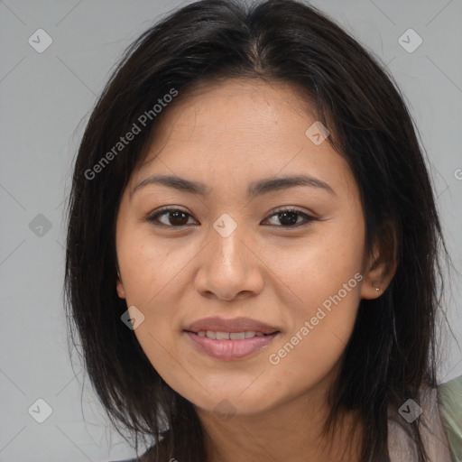 Joyful latino young-adult female with medium  brown hair and brown eyes