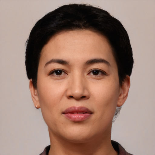 Joyful white young-adult female with short  black hair and brown eyes