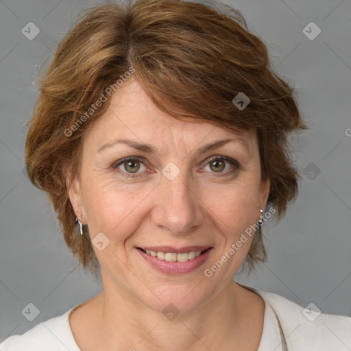 Joyful white adult female with medium  brown hair and blue eyes