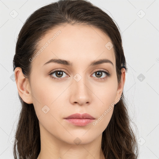 Neutral white young-adult female with long  brown hair and brown eyes