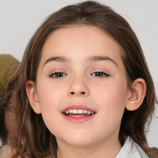 Joyful white child female with medium  brown hair and brown eyes