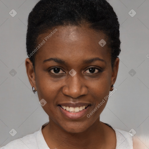 Joyful black young-adult female with short  black hair and brown eyes