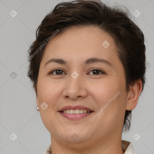 Joyful white adult female with short  brown hair and brown eyes