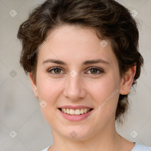 Joyful white young-adult female with medium  brown hair and green eyes