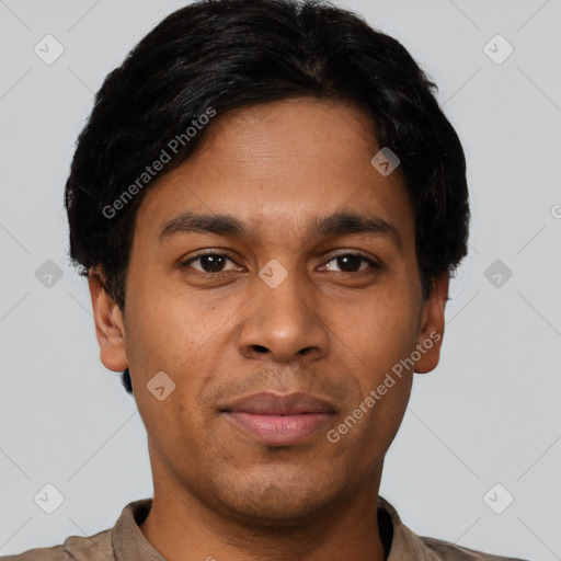 Joyful latino young-adult male with short  black hair and brown eyes