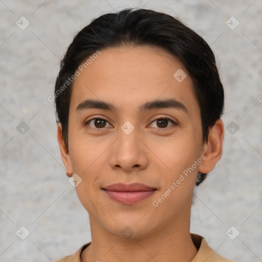 Joyful latino young-adult male with short  brown hair and brown eyes