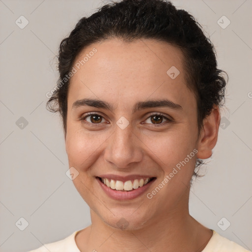 Joyful white young-adult female with short  brown hair and brown eyes