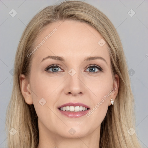 Joyful white young-adult female with long  brown hair and blue eyes