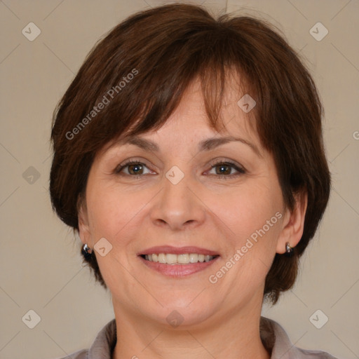 Joyful white adult female with medium  brown hair and brown eyes