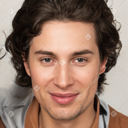 Joyful white young-adult male with medium  brown hair and brown eyes