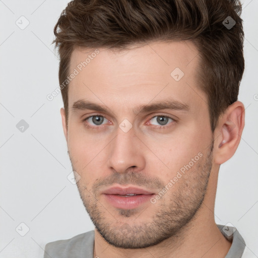 Neutral white young-adult male with short  brown hair and brown eyes