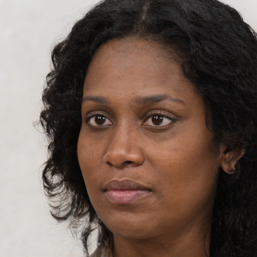 Neutral black adult female with long  black hair and brown eyes