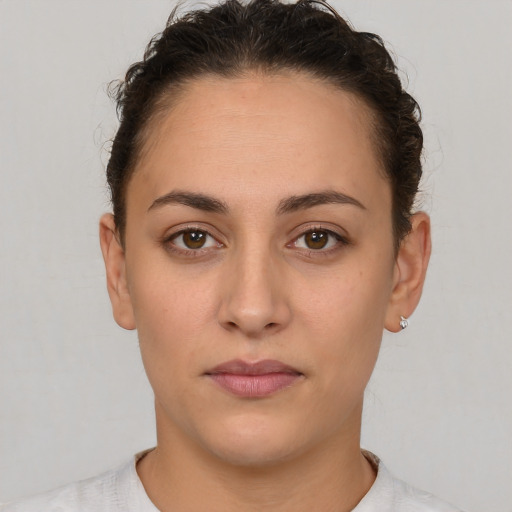 Neutral white young-adult female with short  brown hair and brown eyes