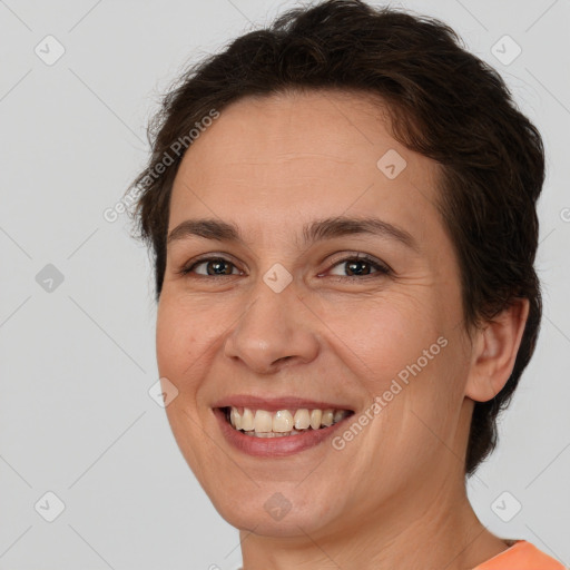 Joyful white adult female with short  brown hair and brown eyes