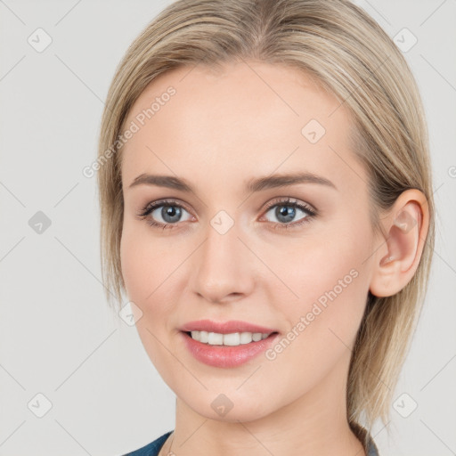 Joyful white young-adult female with medium  brown hair and blue eyes