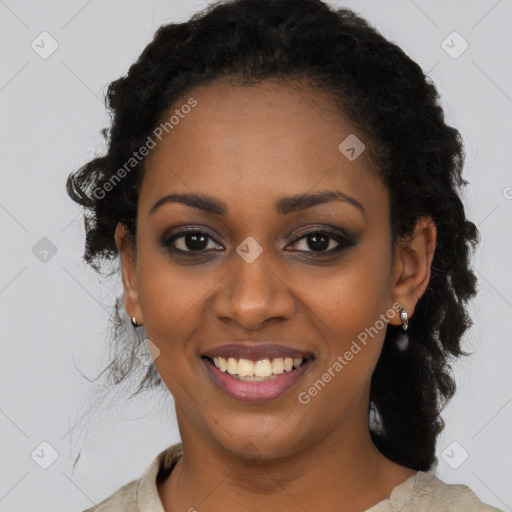 Joyful black young-adult female with long  black hair and brown eyes