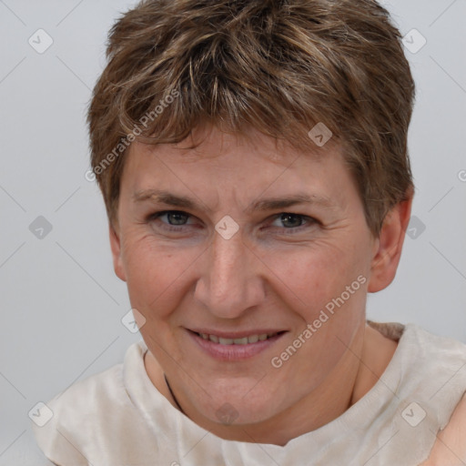 Joyful white adult female with short  brown hair and brown eyes