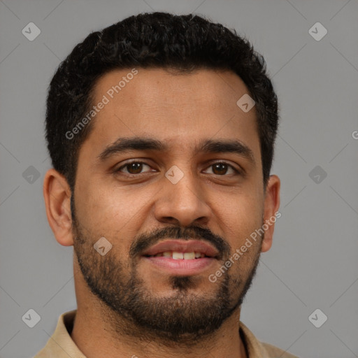Joyful black young-adult male with short  brown hair and brown eyes