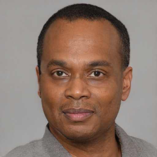 Neutral black adult male with short  black hair and brown eyes