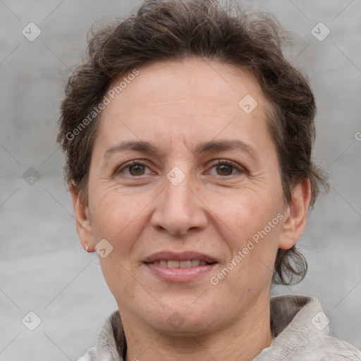 Joyful white adult female with short  brown hair and brown eyes