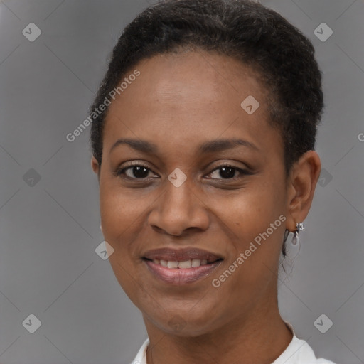 Joyful black young-adult female with short  brown hair and brown eyes