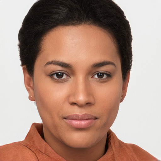 Joyful latino young-adult female with short  brown hair and brown eyes