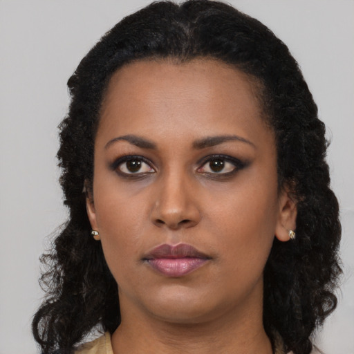 Neutral black young-adult female with long  black hair and brown eyes