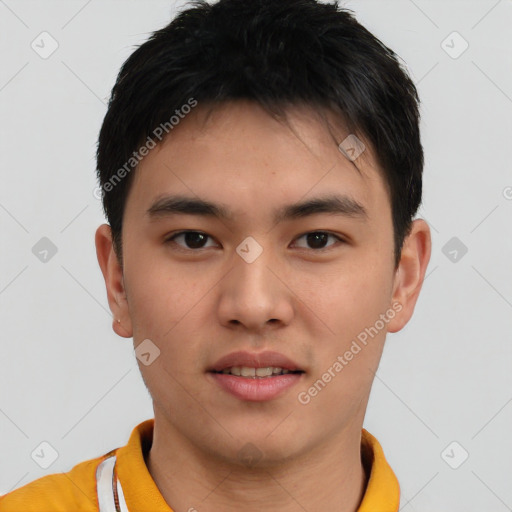 Joyful asian young-adult male with short  black hair and brown eyes