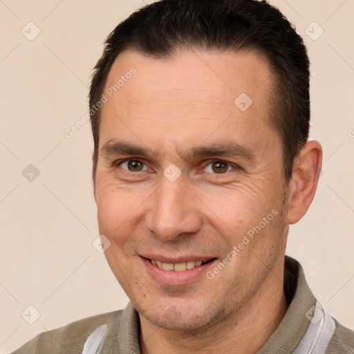 Joyful white adult male with short  brown hair and brown eyes