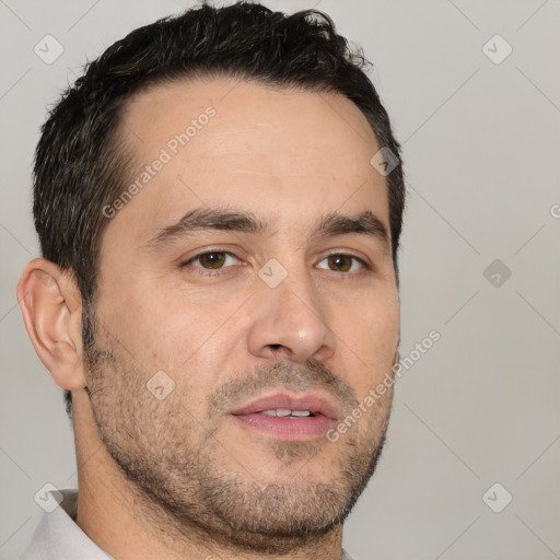 Joyful white adult male with short  brown hair and brown eyes