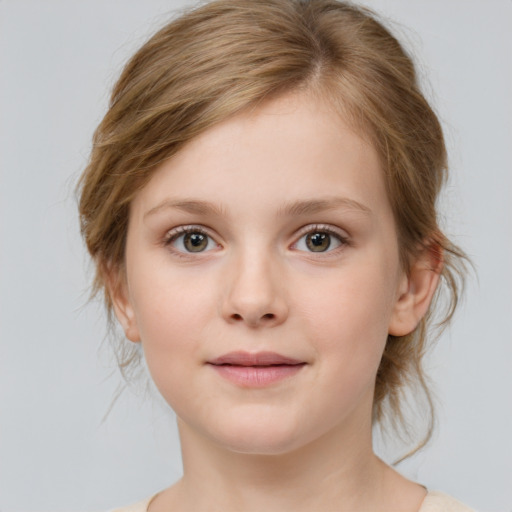 Joyful white child female with medium  brown hair and grey eyes