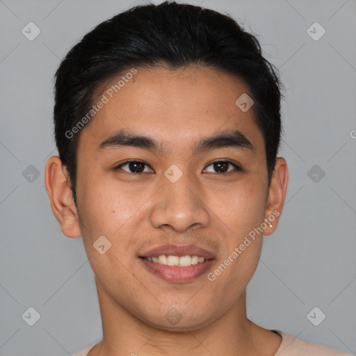 Joyful asian young-adult male with short  black hair and brown eyes